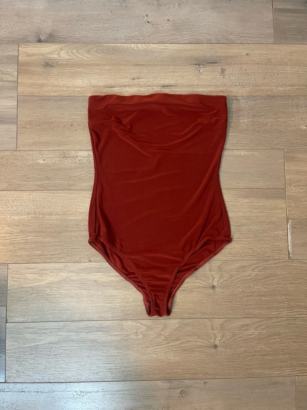 Fashion Nova Strapless One-Piece Bodysuit in Brick Red